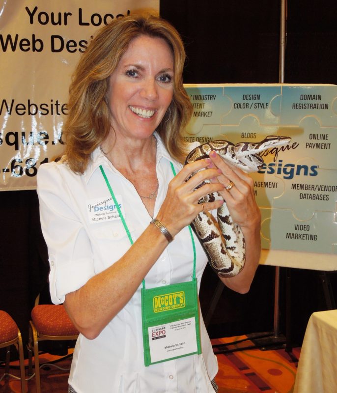 Michele Schalin with Josiesque Designs with a snake from the San Marcos Nature Center