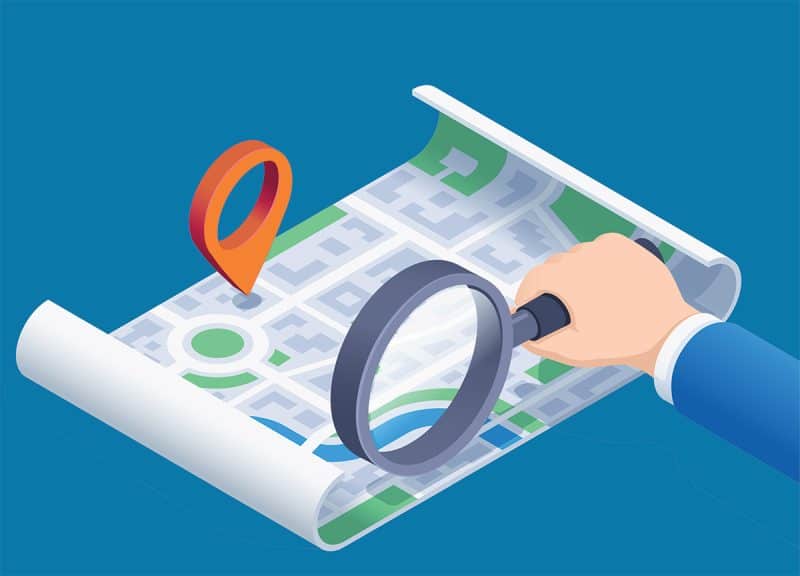 illustration of local seo with a map, a pin on the map, and an arm holding a magnifying glass