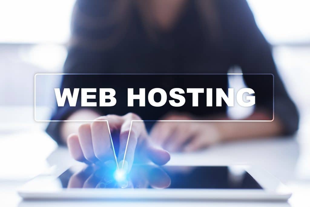 Woman is using tablet pc, pressing on virtual screen and selecting web hosting.